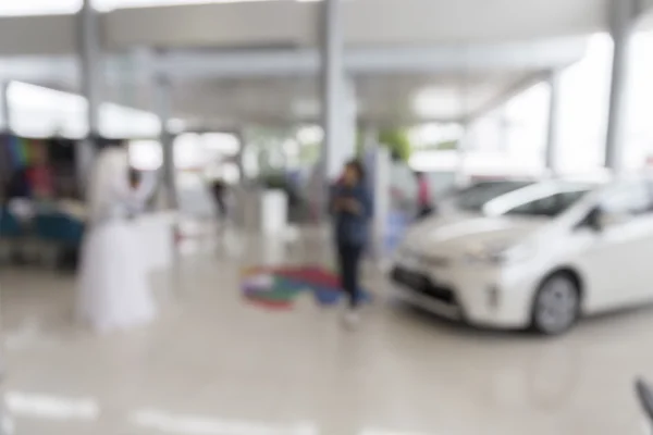 People in car showroom for buyring and selling car business
