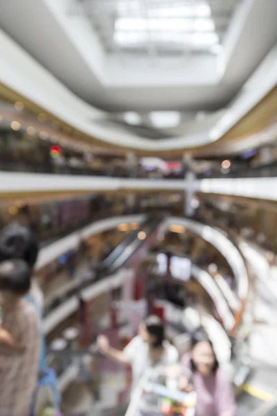 People in department store for use as shopping concept, blur bac