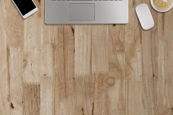Laptop, smartphone, mouse, coffee cup on wooden desk - working c