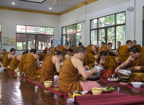The buddhist monk have breakfast given by people who want to mak