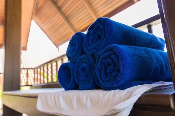 Folded blue towel for spa massage