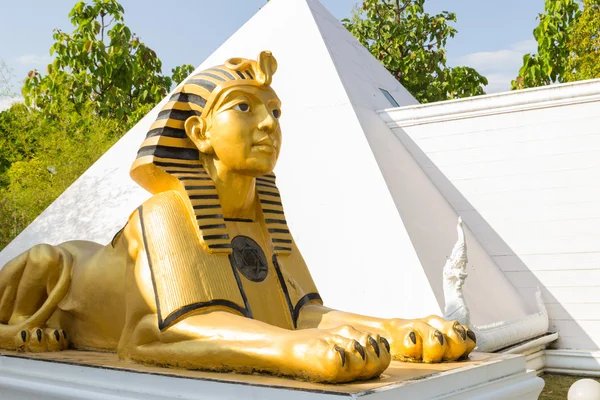 Sphinx statue with white pyramid