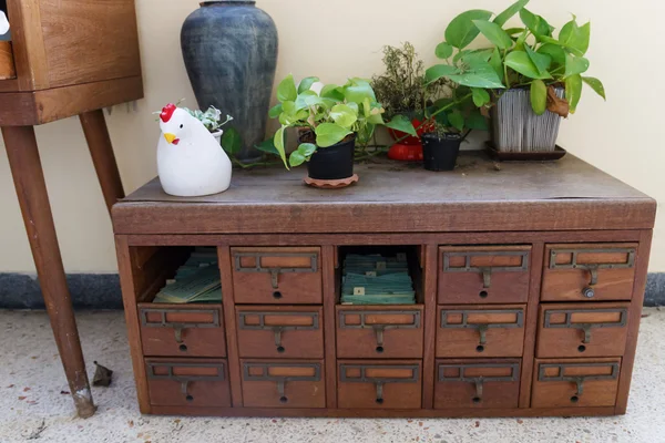 Plant on old wooden desk drawer