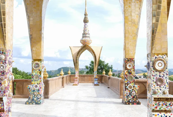 The colorful broken tile and stone decorating on temple wall