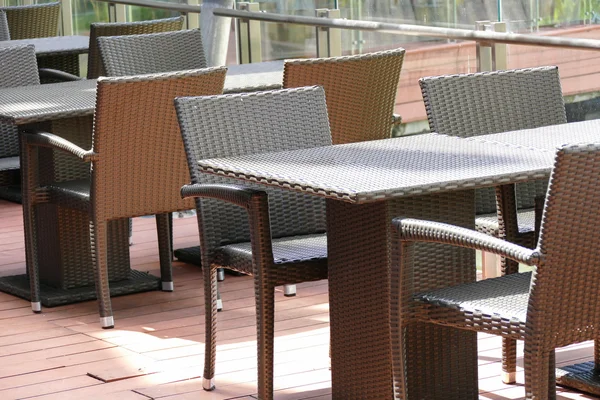 Black rattan table and chair on the terrace