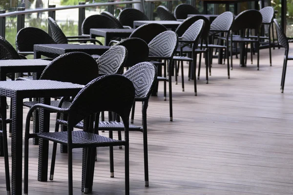 Black rattan table and chair on the terrace