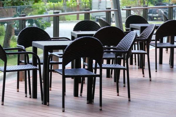 Black rattan table and chair on the terrace