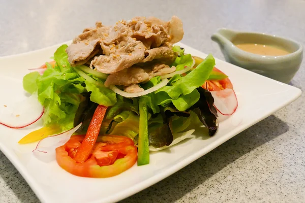 Pork and mix vegetable salad with japanese salad dressing