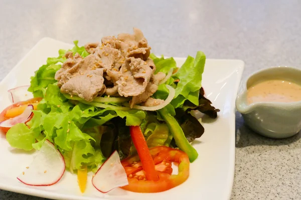 Pork and mix vegetable salad with japanese salad dressing