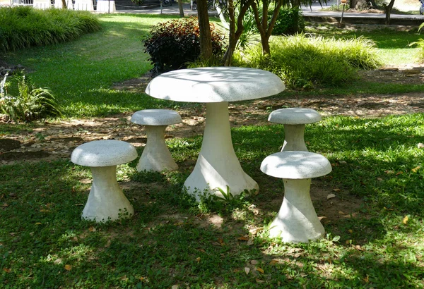 White stone chair and table in the garden