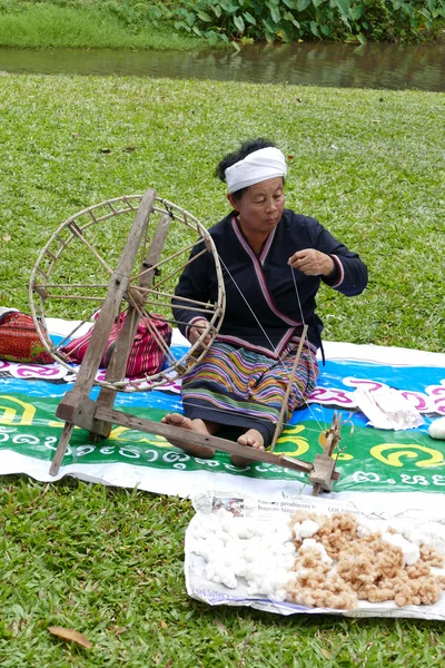 Woman spinning thailand traditional yarn thread