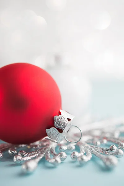 Red and white xmas ornaments on glitter bokeh background. Merry christmas card. Winter holidays. Xmas theme. Happy New Year.