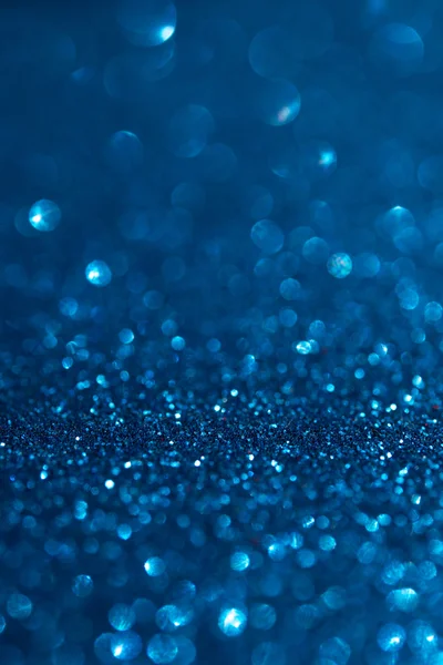 Abstract dark blue glitter bokeh holiday background
