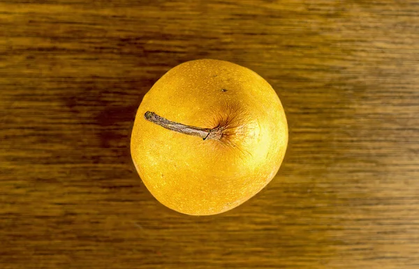 Top view of golden colored pear