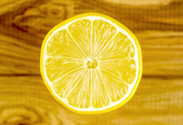 Shiny circular lemon cut with shiny inside pulp