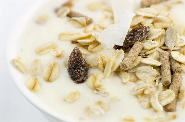 Macro closeup of delicious low-fat yogurt with oats, muesli, bra