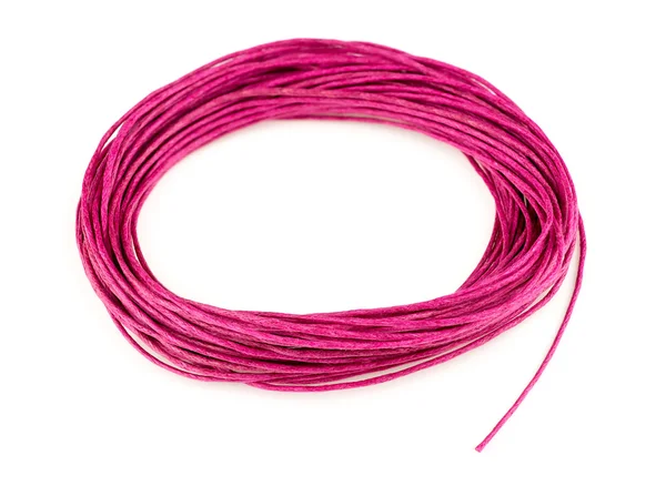 Bright colorful pink woven twine in looped circle isolated on wh