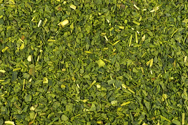 Macro of dried green tea background texture