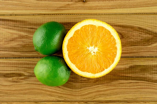 Limes with half orange, overhead