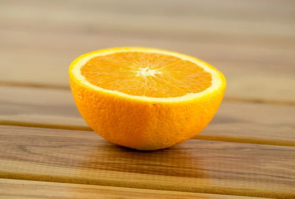 Orange fruit cut in half