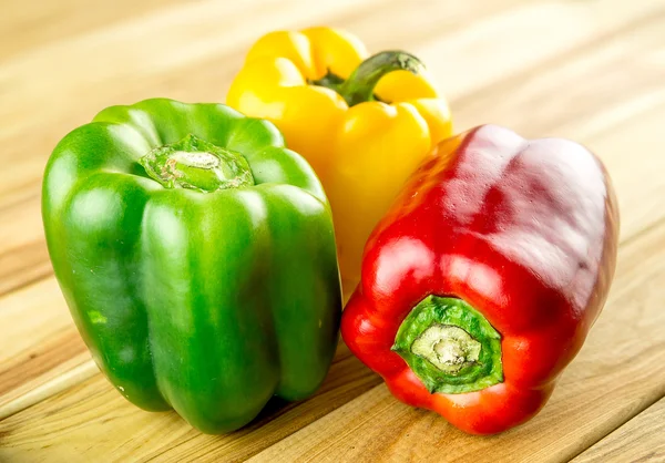 Variety of bell peppers on chopping board