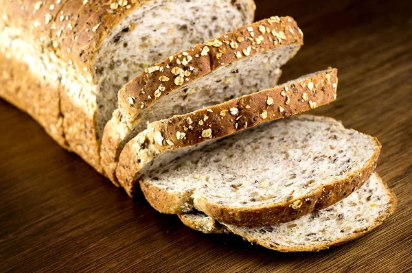 Macro closeup of rustic slices whole wheat multi grain bread on