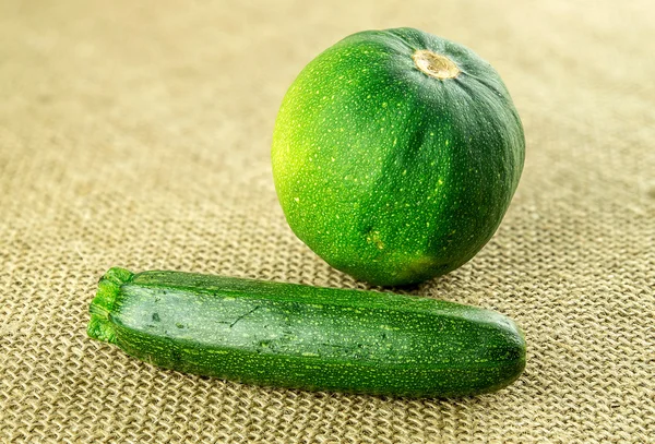 Mini zucchini and round yellowish green gem squash