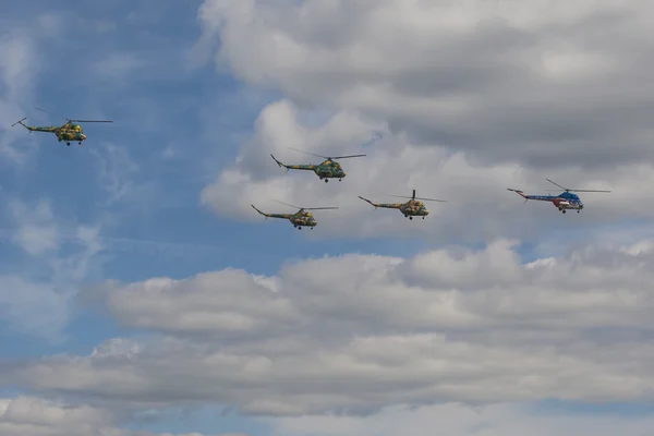 Group of MI-2 Helicopters on Air During Aviation Sport Event