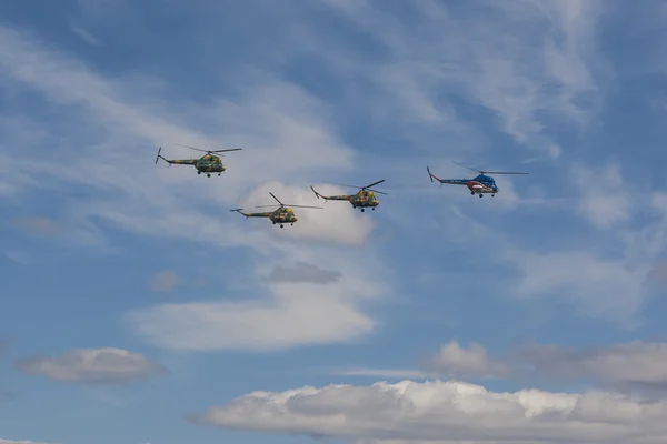 Chain Group of MI-2 Helicopters on Air During Aviation Sport Event