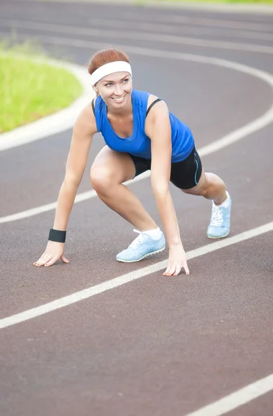 Young Happy Smiling Caucasian Female Athlete Training on Sport Venue