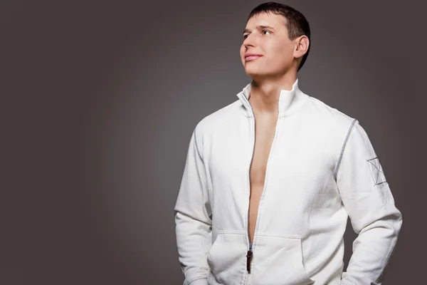 Portrait of Masculine Strong Tanned Caucasian Man in White Jacke