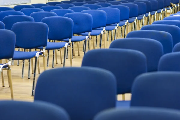 Row of Modern Chairs Standing in Line in The Empty Auditorium.