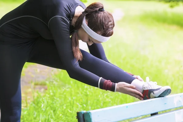 Young Caucasian Woman Having Stretching Exercises Outdors