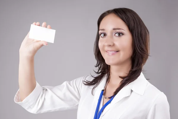 Medical Female Doctor Presenting and Showing White Card for Prod