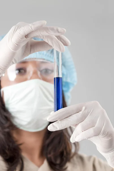 Professional Female Laboratory Staff Holding Lab Glass Flask Wit