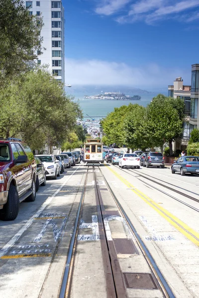 San-Francisco-United States, July 13, 2014: Authentic San-Francisco Tram Ascending Uphill With People on July 13, 2014 in San-Francisco