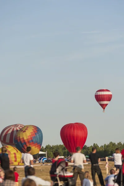 Air Balloon Levitating Over the Crowd of People Standing Outdoors