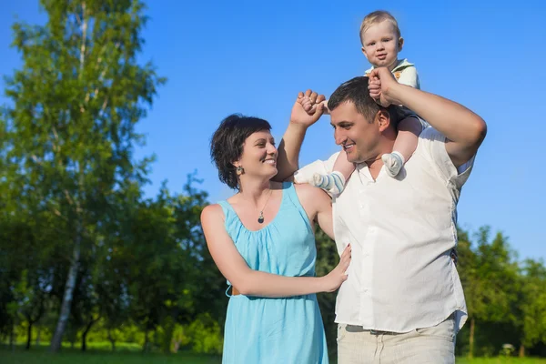 Human Relationships Concepts. Young Caucasian Family of Three People Having Good Time