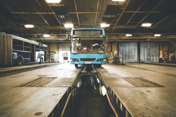 Dirty, oily bus garage inspection pit