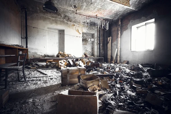 A ruined industrial building interior