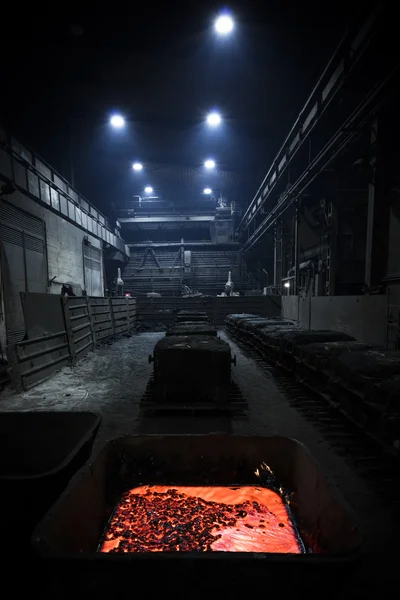 A steel manufacturing plant, interior, poor light