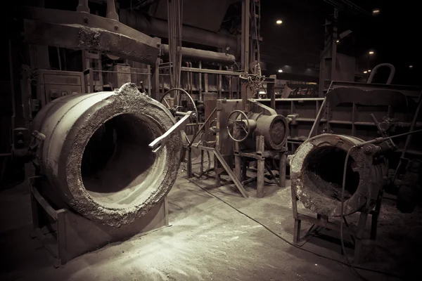 A foundry furnace with an empty tank