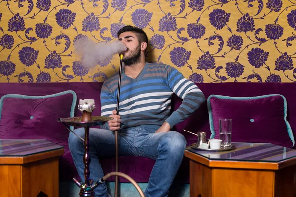 Man Smoking Shisha At Arabic Restaurant