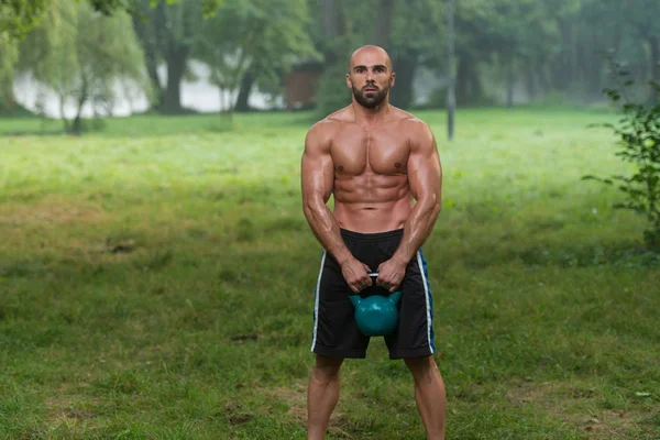 Man During Workout With Kettlebell