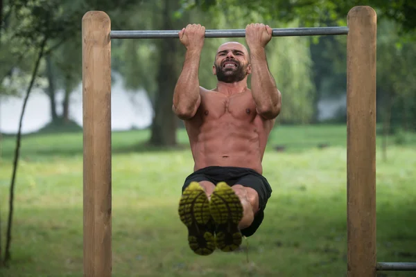 Man Doing Chin Ups A Street Workout