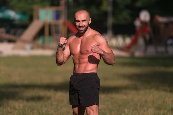 Adult Man Boxing Workout Outdoors In Park