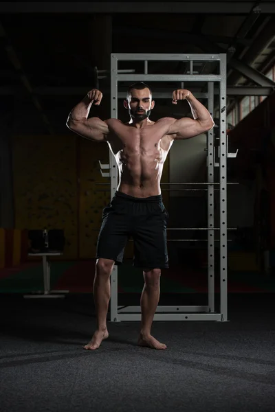 Bodybuilder Performing Front Double Biceps Pose
