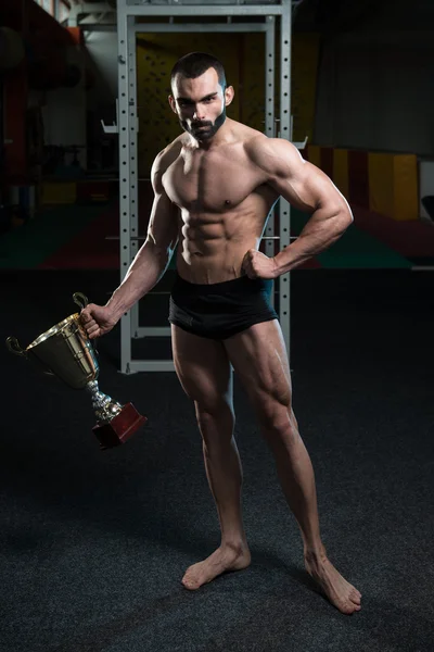 Young Man Competitor Showing His Winning Medal