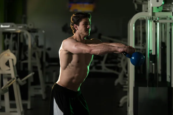 Muscular Man Exercising With Kettle-bell