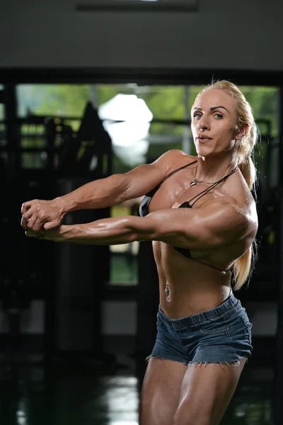 Muscular Woman Flexing Muscles